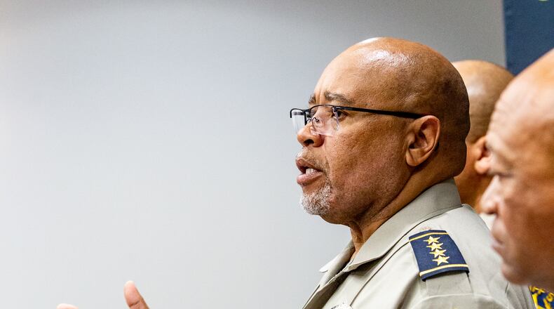 Gwinnett County Sheriff Keybo Taylor, left, addresses the press at the Gwinnett Sheriff's Office in Lawrenceville on Tuesday, June 29, 2021. Sheriff Taylor addresses an extortion lawsuit against him initiated by staff at a bail bonds company which has concluded, the bond service has retracted the lawsuit. (Jenni Girtman for The Atlanta Journal-Constitution