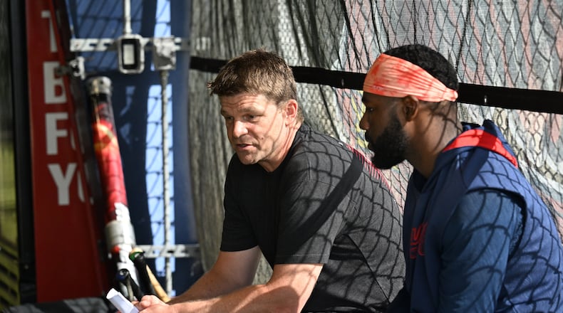 Atlanta Braves new hitting coach Tim Hyers confers with outfielder Michael Harris II (right) in an indoor batting practice facility during spring training workouts at CoolToday Park, Saturday, February 15, 2025, North Port, Florida. (Hyosub Shin / AJC)