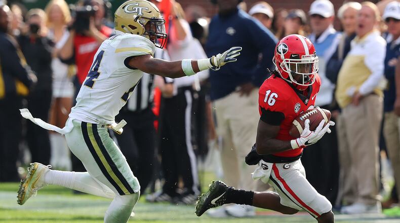 November 25, 2017 Atlanta: Georgia wide receiver Ahkil Crumpton breaks away from Georgia Tech defensive back Corey Griffin for a touchdown to take a 38-7 lead during the fourth quarter in a NCAA college football game on Saturday, November 25, 2017, in Atlanta. Georgia beat Georgia Tech 38-7. Curtis Compton/ccompton@ajc.com