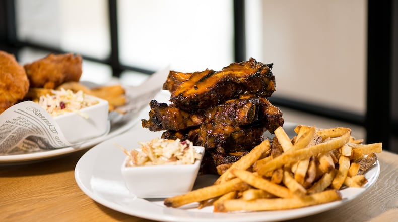 Howell's Kitchen and Bar Peach-Smoked Baby Back Ribs with house barbacue sauce, hand-cut fries, and cabbage slaw. Photo credit- Mia Yakel.