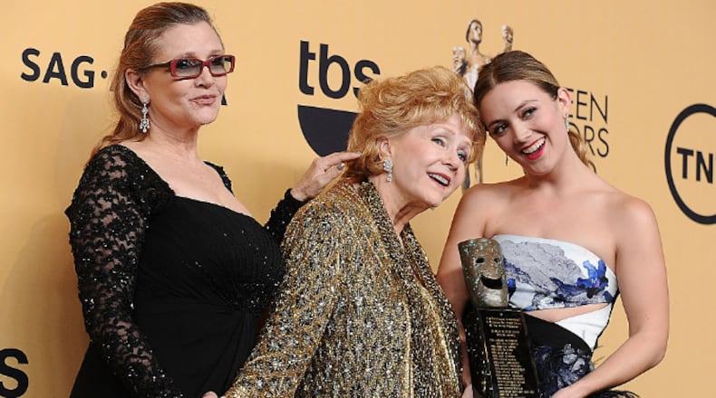 LOS ANGELES, CA - JANUARY 25: (L-R) Carrie Fisher, Debbie Reynolds and Billie Catherine Lourd pose in the press room at the 21st annual Screen Actors Guild Awards at The Shrine Auditorium on January 25, 2015 in Los Angeles, California. (Photo by Jason LaVeris/FilmMagic)