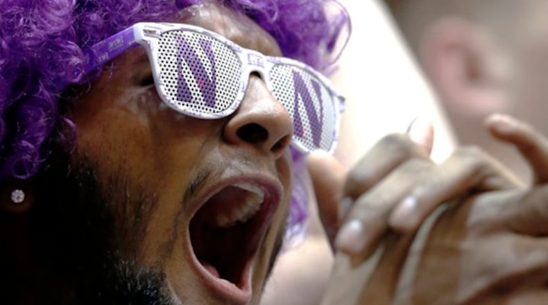 A Northwestern fan cheers for his team before an NCAA college basketball game between Purdue and Northwestern Sunday, March 5, 2017, in Evanston, Ill. (AP Photo/Nam Y. Huh)