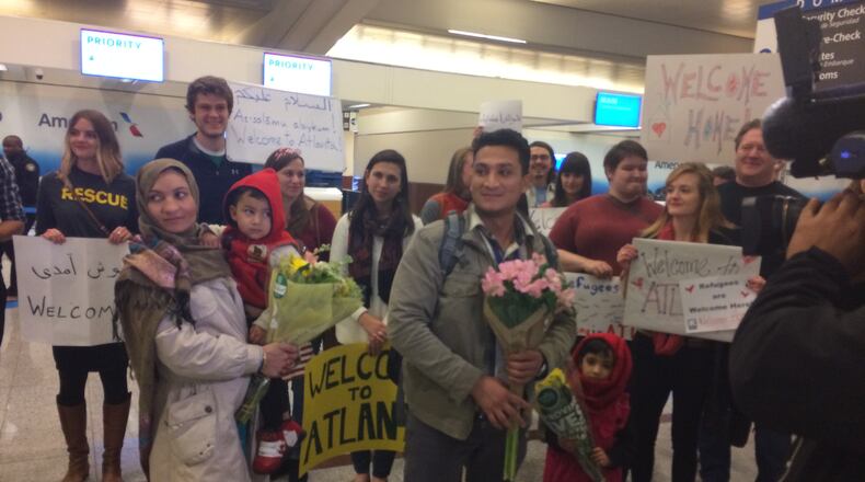 Wali Omari and his wife Parwana, along with their five-year-old daughter and three-year-old son landed at Hartsfield Jackson International-Airport just before midnight. Photo Ellen Eldridge