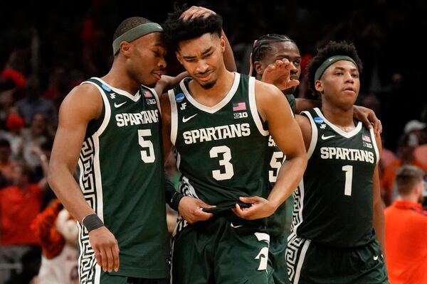 Michigan State players leave the court after losing to Auburn after the Elite Eight of the NCAA college basketball tournament, Sunday, March 30, 2025, in Atlanta. (AP Photo/George Walker IV)