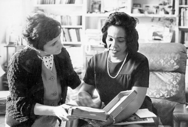 Kathryn Johnson and Coretta Scott King examine keepsakes of the Rev. Martin Luther King Jr. shortly after his assassination. Johnson was "very close to Coretta," former Mayor Andrew Young said. Photo courtesy of Kathryn Johnson.