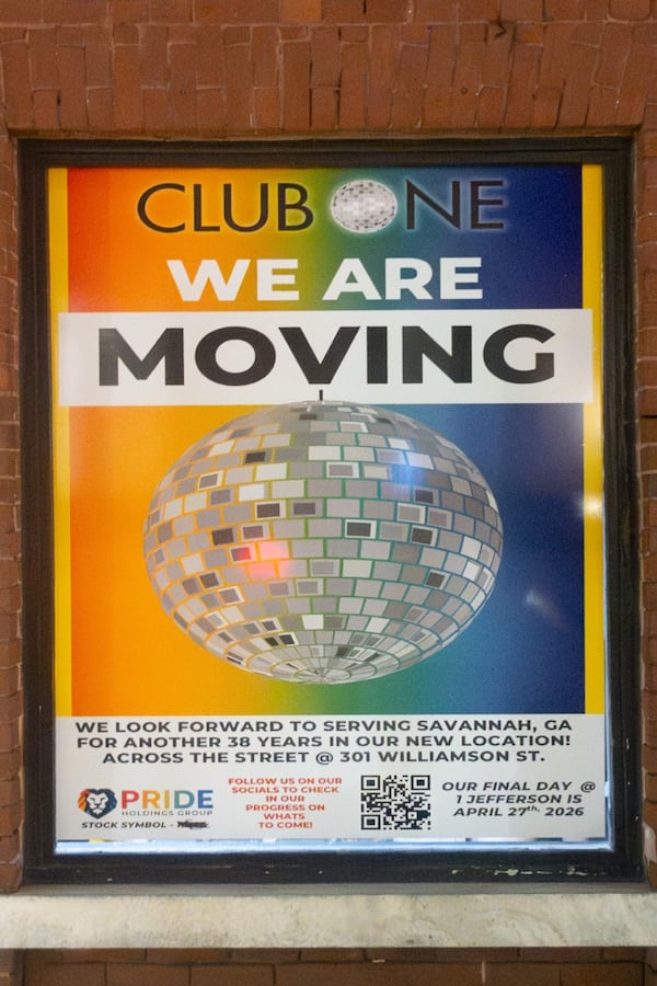A sign from Club One announcing the business' move to a new location.