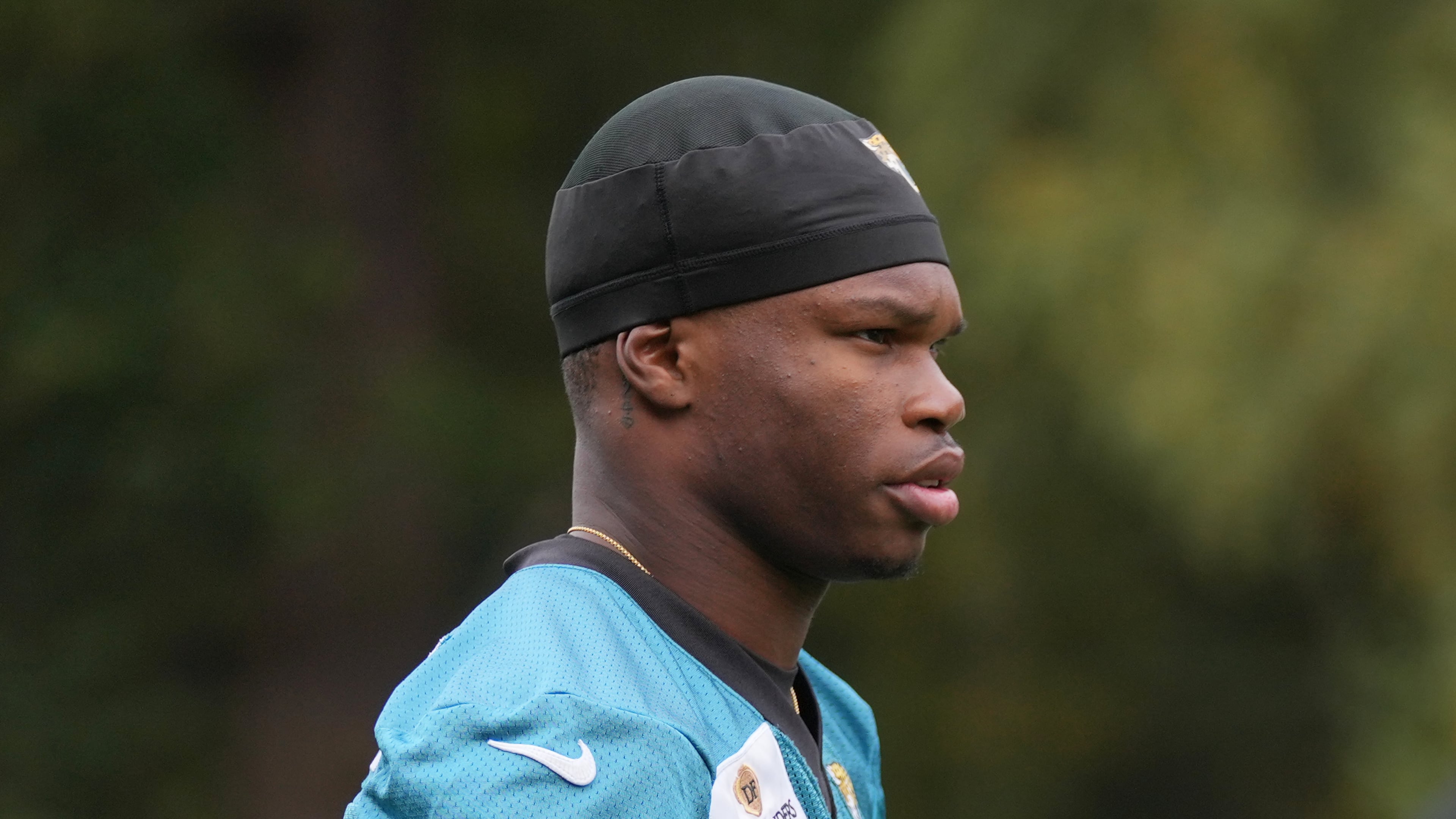 Jacksonville Jaguars wide receiver Travis Hunter (12), attends an NFL football practice at The Grove in Watford, England, Friday, Oct. 17, 2025. (AP Photo/Kin Cheung)