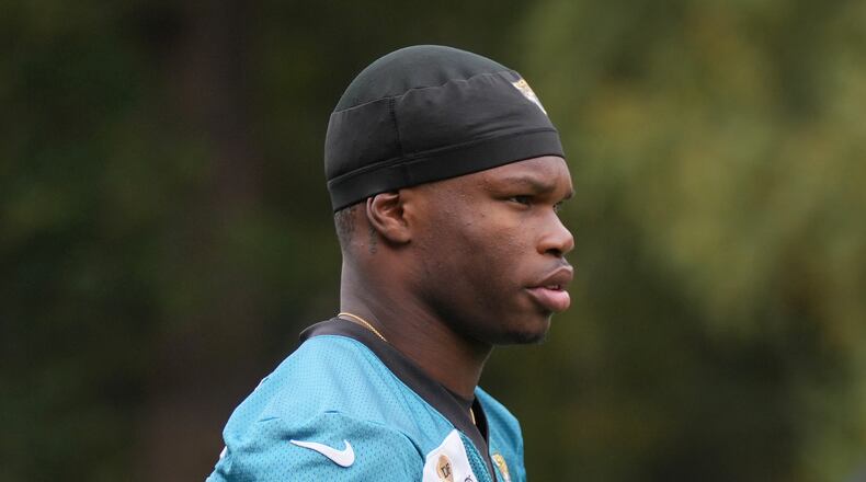 Jacksonville Jaguars wide receiver Travis Hunter (12), attends an NFL football practice at The Grove in Watford, England, Friday, Oct. 17, 2025. (AP Photo/Kin Cheung)