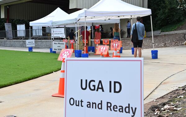 Students and faculty members wait in line at the COVID Surveillance Asymptomatic Testing center at Legion Field as the University of Georgia started classes for the fall semester on Thursday, August 20, 2020. (Hyosub Shin / Hyosub.Shin@ajc.com)