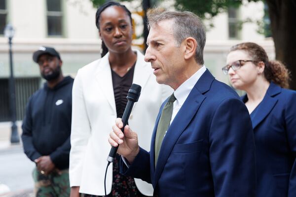Leonard Goodman, an attorney for African People's Socialist Party leaders Omali Yeshitela, Penny Hess and Jesse Nevel, speaks outside the 11th U.S. Circuit Court of Appeals in Atlanta on Wednesday after asking a three-judge panel to overturn his clients' convictions. (Estela Muñoz/AJC)