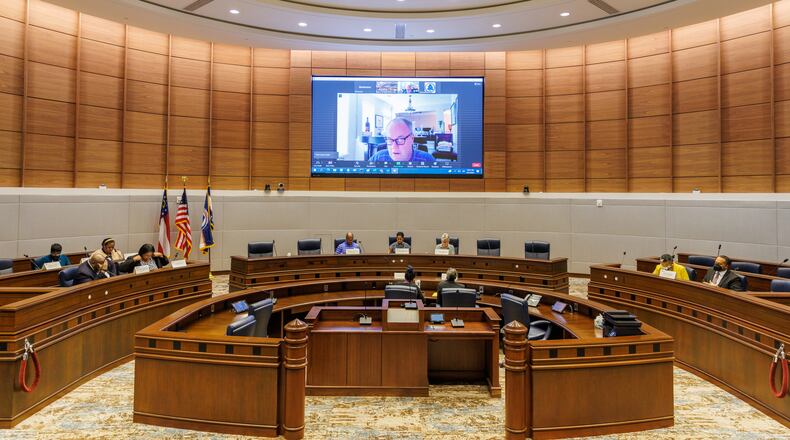 The Fulton County Board of Registration and Elections meets at the Assembly Hall of the Fulton County Government Center to certify the June general primary run-off election on Monday, June 27, 2022. (Arvin Temkar / arvin.temkar@ajc.com)