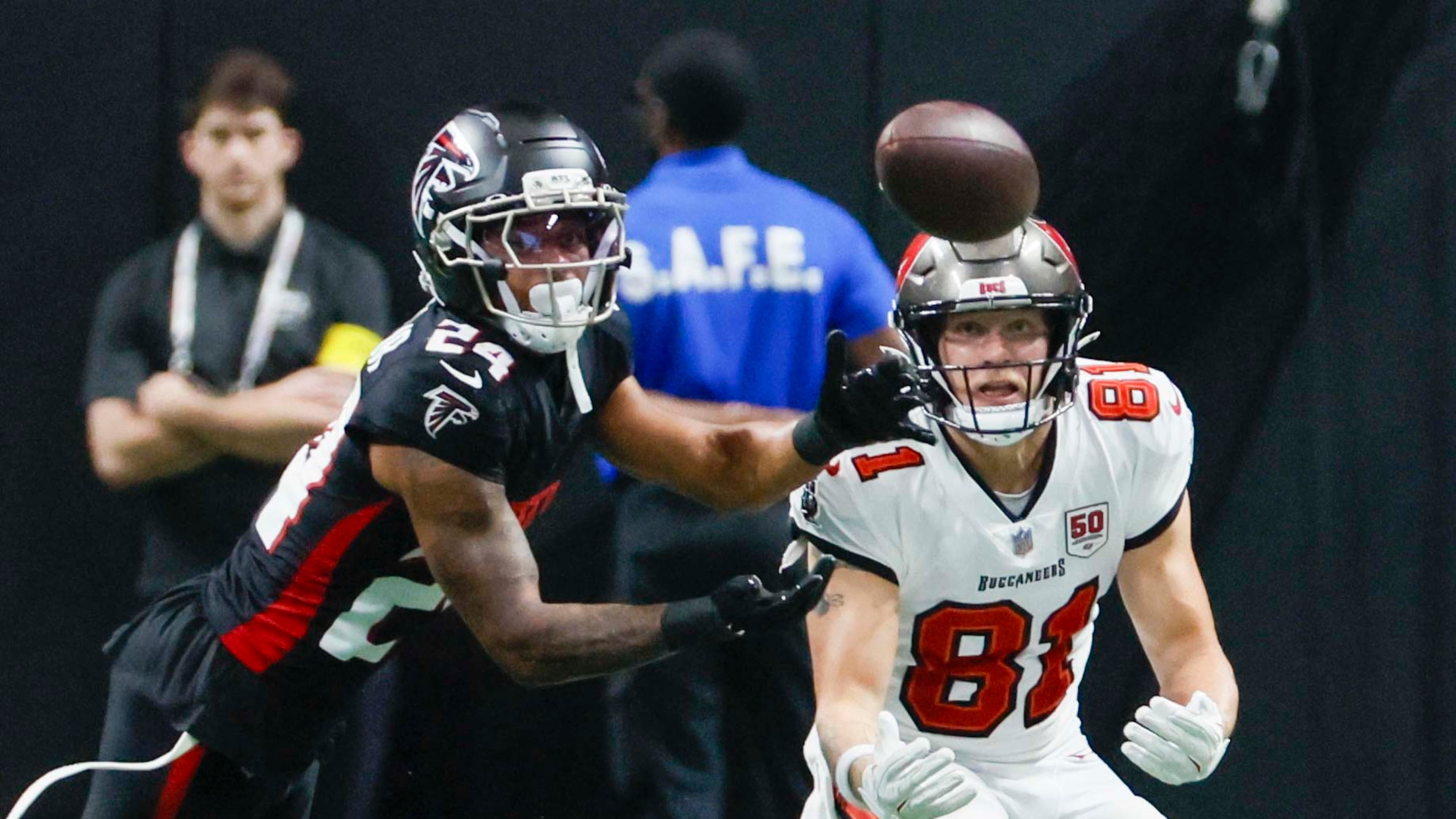 Falcons cornerback A.J. Terrell Jr. (left) — pictured fighting with Buccaneers wide receiver Ryan Miller for the ball on Sept. 7 — is returning to Atlanta's lineup after missing two games with a hamstring injury. (Miguel Martinez/AJC)