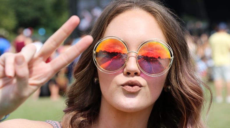From the classic Wayfarer frames in a multitude of colors to eclectic statement pieces (like purple hair, body paint and graphic tees), Atlanta stepped out at Music Midtown in Piedmont Park with an abundance of style. Here are our favorite looks we've spotted (so far)!