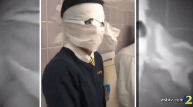 In the video, obtained by Channel 2 Action News, boys are shown wrapping toilet paper around their heads, cutting holes only for their eyes.