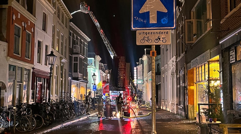 Firefighters extinguish the fire at the scene of an explosion in Utrecht, Netherlands, Thursday, Jan. 15, 2026. (AP Photo/Ahmad Seir)