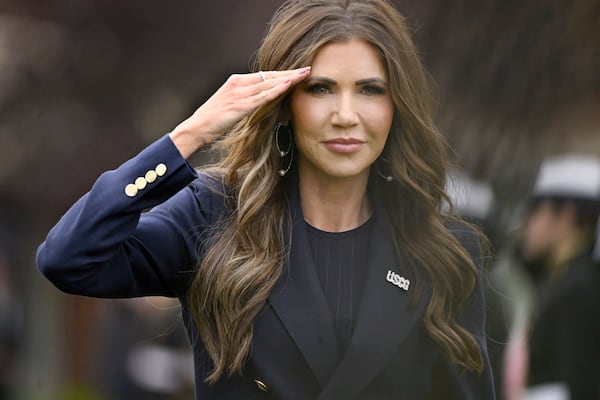 Homeland Security Secretary Kristi Noem salutes as she arrives at the commencement for the United States Coast Guard Academy, Wednesday, May 21, 2025 in New London, Conn. (AP Photo/Jessica Hill)