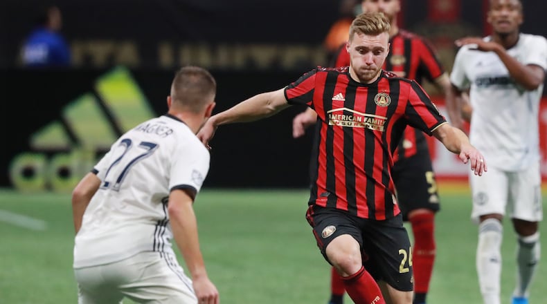 October 24, 2019 Atlanta: Atlanta United midfielder Julian Gressel passes the ball around Philadelphia defender Kai Wagner in the Eastern Conference semifinals of the MLS playoffs on Thursday, October 24, 2019, in Atlanta.   Curtis Compton/ccompton@ajc.com