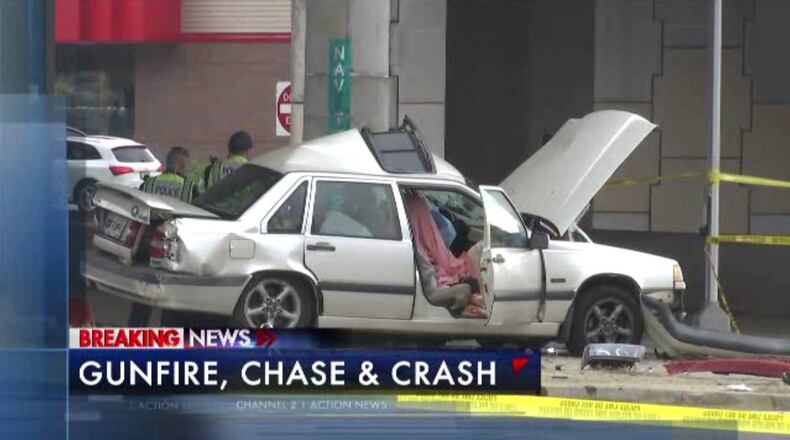A chase and shooting on a major Gwinnett County road led to a woman’s death Thursday afternoon.