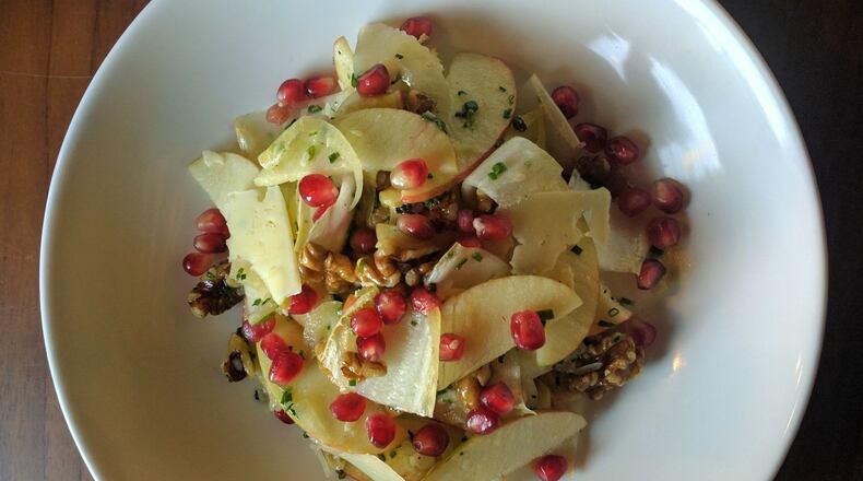 An apple and Belgian endive salad is sprinkled with pomegranate seeds. (Contributed by Spring)