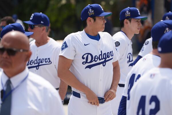 Los Angeles Dodgers' Shohei Ohtani attends an event to commemorate Jackie Robinson Day before a baseball game against the Colorado Rockies Tuesday, April 15, 2025, in Los Angeles. (AP Photo/Damian Dovarganes)