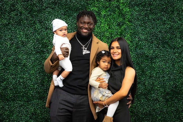Former Georgia Tech linebacker Demetrius Knight (who later transferred to Charlotte and then South Carolina) was selected in the second round of the 2025 NFL draft by the Cincinnati Bengals. This is a family portrait with wife Jensy, daughter Kamila (held by Jensy) and son Malachi (held by Demetrius). (Photo courtesy of Stephanie Knight)