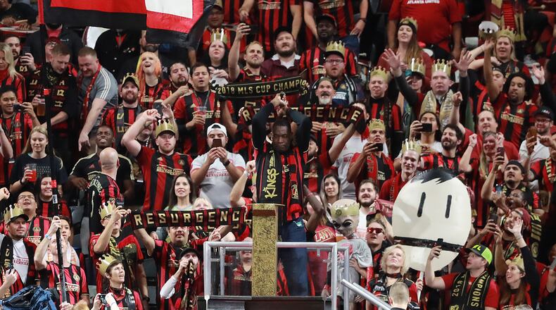 October 30, 2019 Atlanta: Former Atlanta Hawks star Dikembe Mutombo hammers the golden spike to help open the match between Atlanta United and Toronto FC in the Eastern Conference Final on Wednesday, October 30, 2019, in Atlanta.   Curtis Compton/ccompton@ajc.com