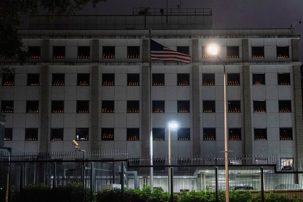 Candles are lit inside the windows of the U.S. Consulate in Hong Kong on the 36th anniversary of China's Tiananmen Square crackdown, in Hong Kong, Wednesday, June 4, 2025. (AP Photo/Chan Long Hei)
