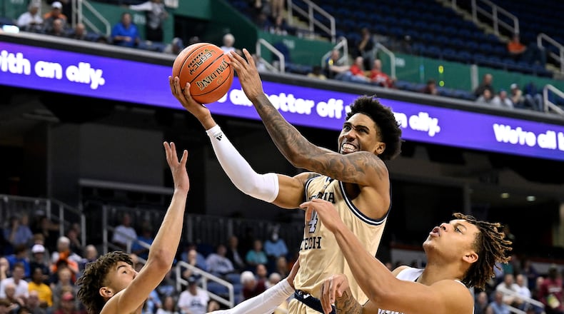 Georgia Tech's Ja'von Franklin drives between Florida State's Jalen Warley (1) and Cam Corhen during the second half in the first round of the ACC Tournament on Tuesday in Greensboro, North Carolina. (Grant Halverson/TNS)