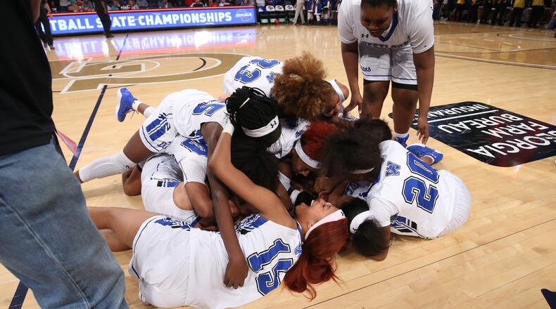 March 10, 2018 - Atlanta, Ga: Westlake players celebrate their win against Newton in the GHSA Class AAAAAAA Girls State Championship at McCamish Pavilion Saturday, March 10, 2018, in Atlanta. Westlake won 60-45. PHOTO / JASON GETZ