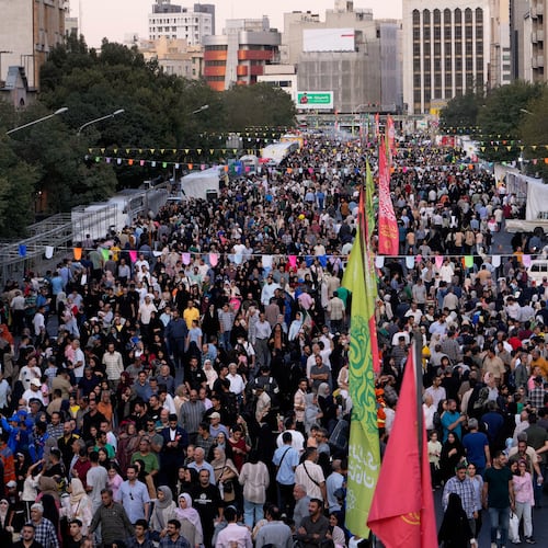 Crowds fill a street during celebrations marking Prophet Muhammad's birthday in Tehran, Iran, Sunday, Aug. 30, 2026. (AP Photo/Vahid Salemi)