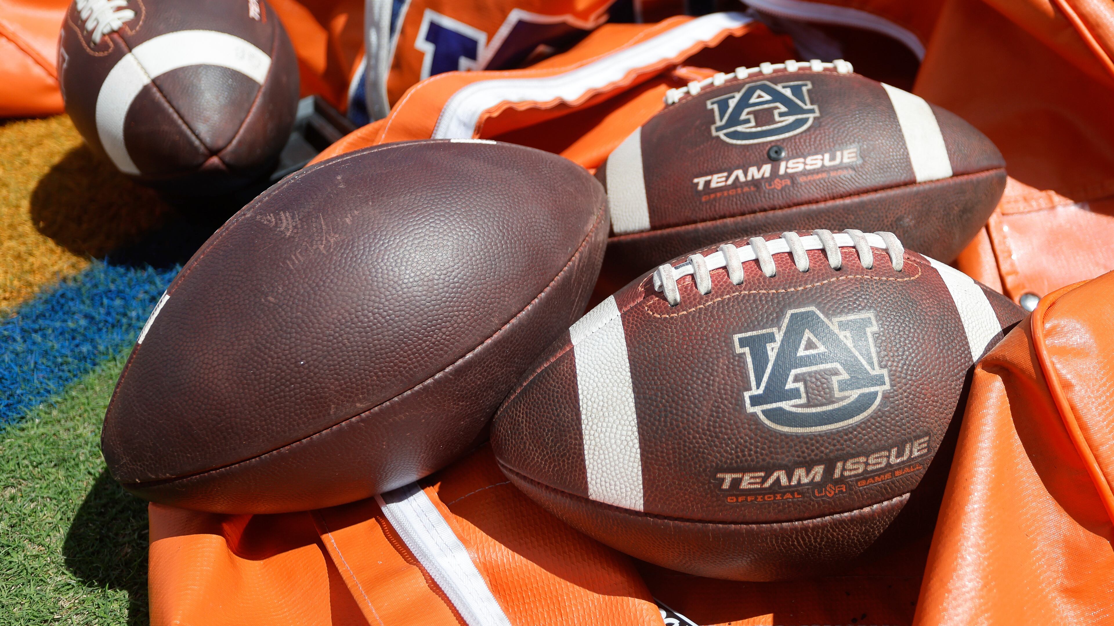 FILE - Auburn footballs sit in a bag prior to an NCAA football game against Georgia, Sept. 30, 2023, in Auburn, Ala. (AP Photo/Stew Milne, File)