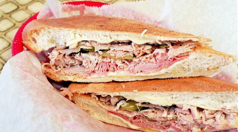 At Havana Restaurant, a Cuban sandwich consists of ham, roast pork, cheese and pickles on Cuban bread. (Contributed)