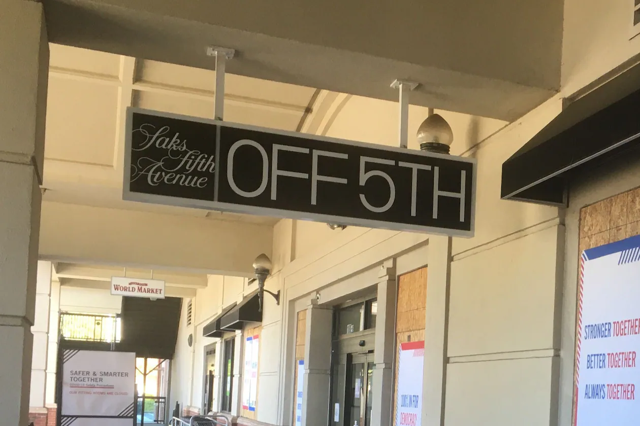 The Saks Off 5th in Buckhead will remain open after the company announced dozens of closures across the United States. (AJC file)