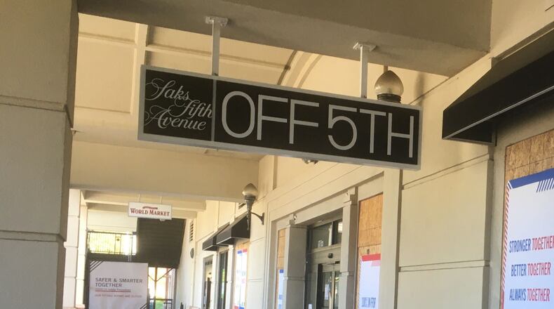 The Saks Off 5th in Buckhead will remain open after the company announced dozens of closures across the United States. (AJC file)