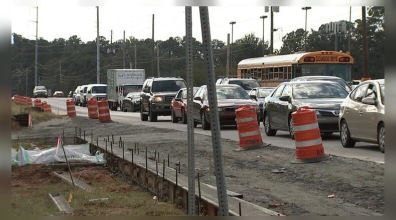 Someone drove through a construction zone in Cobb County and hit a worker, police said.