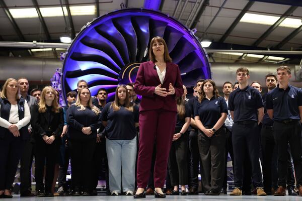 Britain's Chancellor of the Exchequer Rachel Reeves, center, speaks with the media at the Rolls-Royce factory in Derby, England following the announcement from the Office for National Statistics that the U.K. economy grew by 0.7% between January and March, Thursday, May 15, 2025. (Darren Staples/PA via AP)