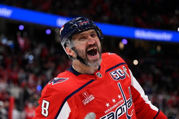 Washington Capitals left wing Alex Ovechkin (8) celebrates his goal during the first period of an NHL hockey game against the Philadelphia Flyers, Thursday, March 20, 2025, in Washington. (AP Photo/Nick Wass)