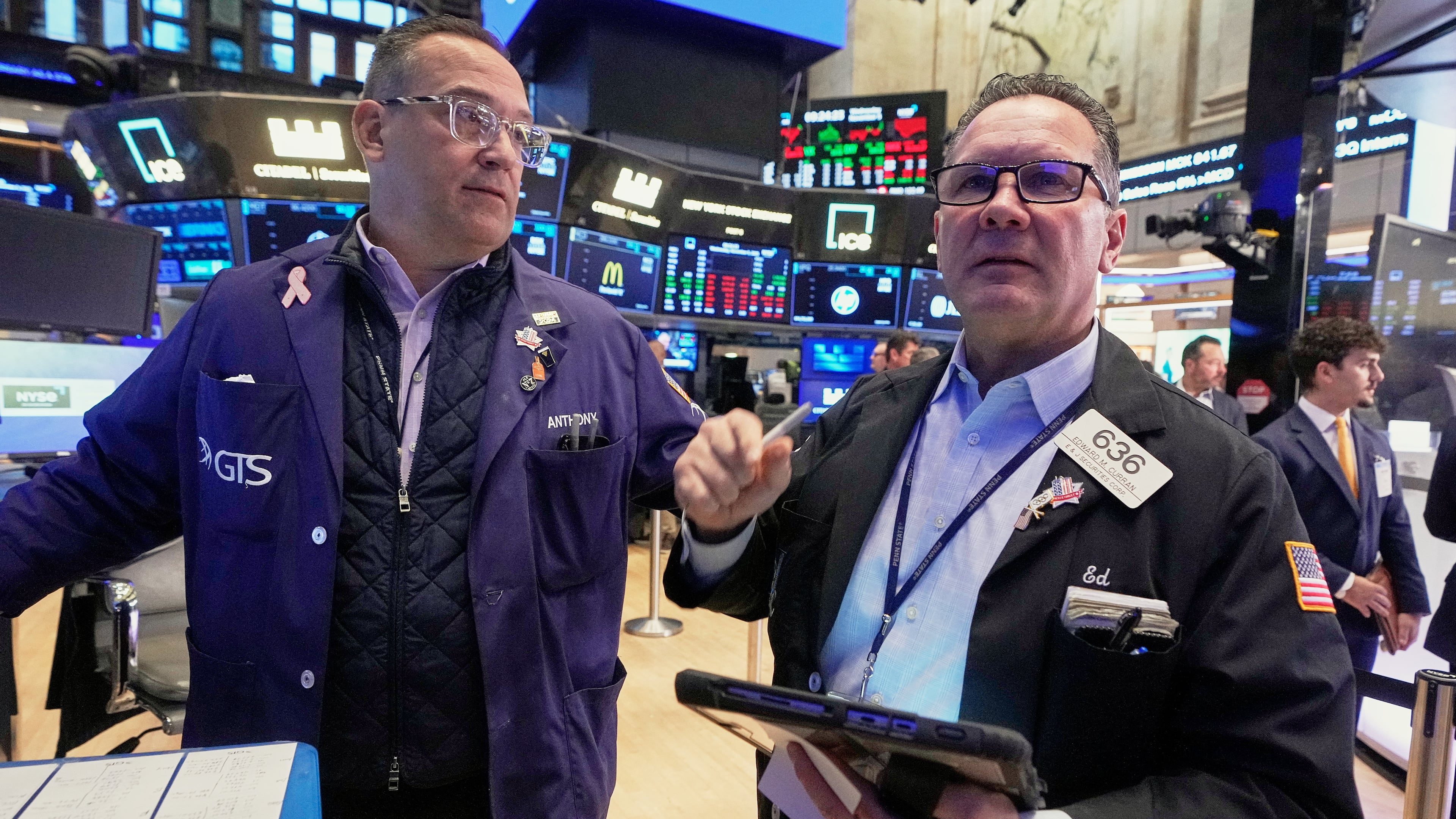 Specialist Anthony Matesic, left, and trader Edward Curran work on the floor of the New York Stock Exchange, Wednesday, Nov. 5, 2025. (AP Photo/Richard Drew)