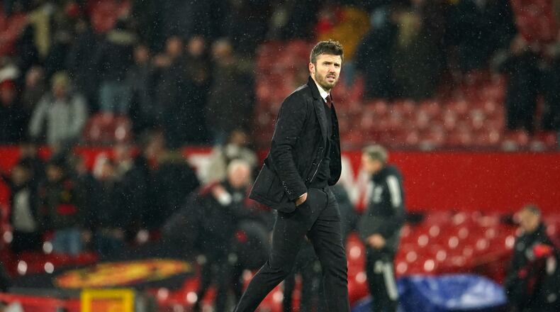 FILE - Manchester United's temporary coach Michael Carrick walks off the pitch at the end of the English Premier League soccer match between Manchester United and Arsenal at Old Trafford stadium in Manchester, England, Thursday, Dec. 2, 2021. (AP Photo/Dave Thompson, File)