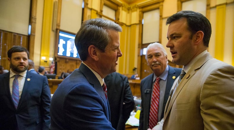 Gov. Brian Kemp shakes the hand of state Sen. Burt Jones, author of a measure that would allow the state to take over Atlanta’s airport, on the final day of the 2019 session of the Legislature. ALYSSA POINTER/ALYSSA.POINTER@AJC.COM