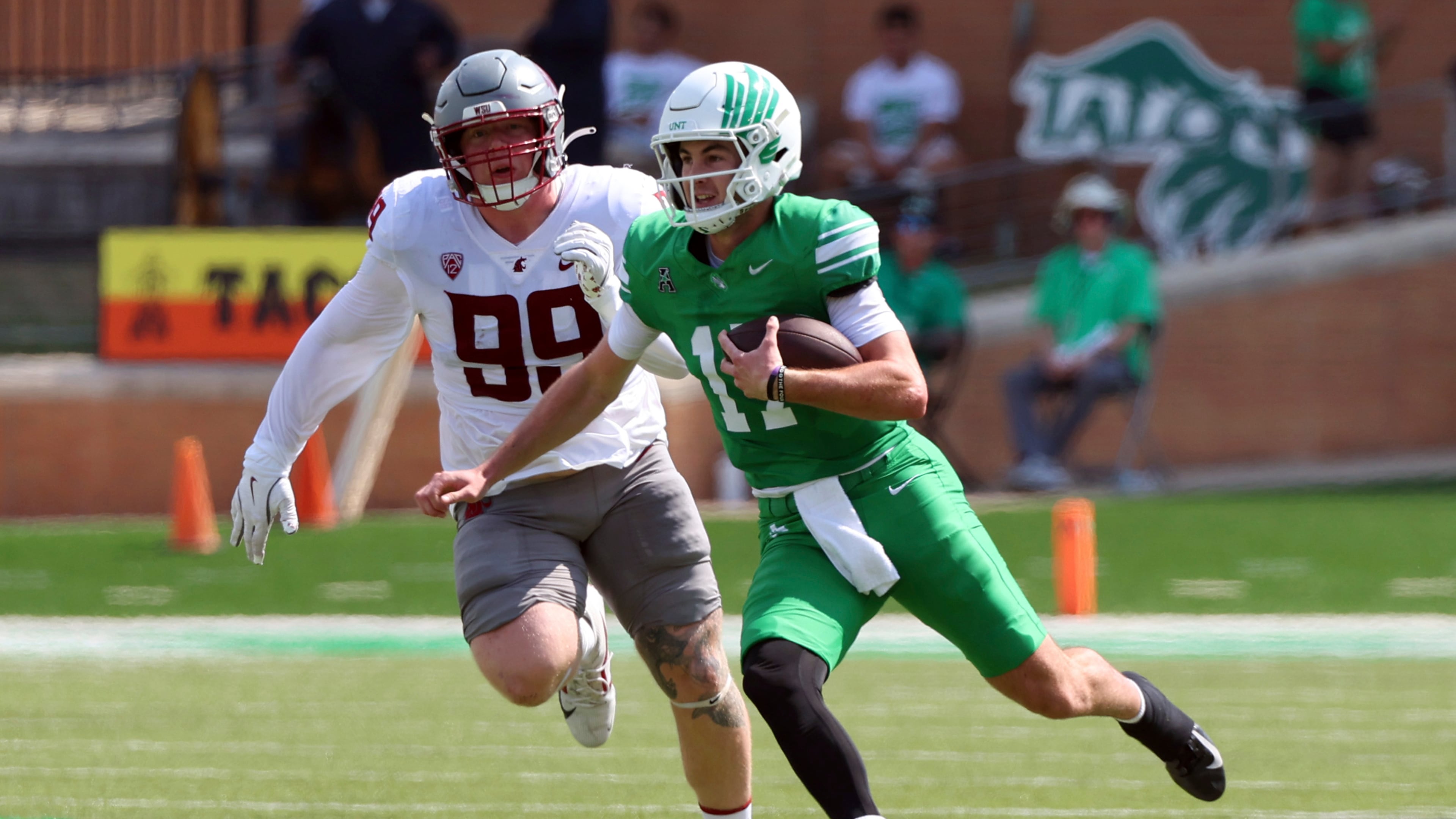 Washington State defensive tackle Bryson Lamb (99) pursues North Texas quarterback Drew Mestemaker (17), who runs with the ball, in the second quarter of an NCAA college football game, Saturday, Sept. 13, 2025, in Denton, Texas. (AP Photo/Richard W. Rodriguez)