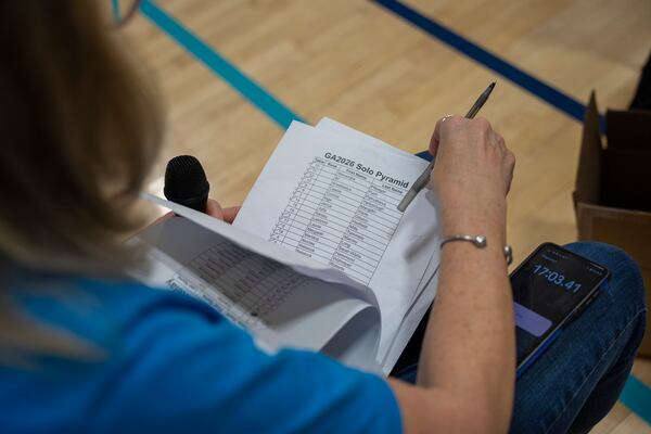 Lauralee Angell logs the results at the Georgia Speed Puzzling Championship at the Marcus Jewish Community Center of Atlanta. (Olivia Bowdoin for the AJC)