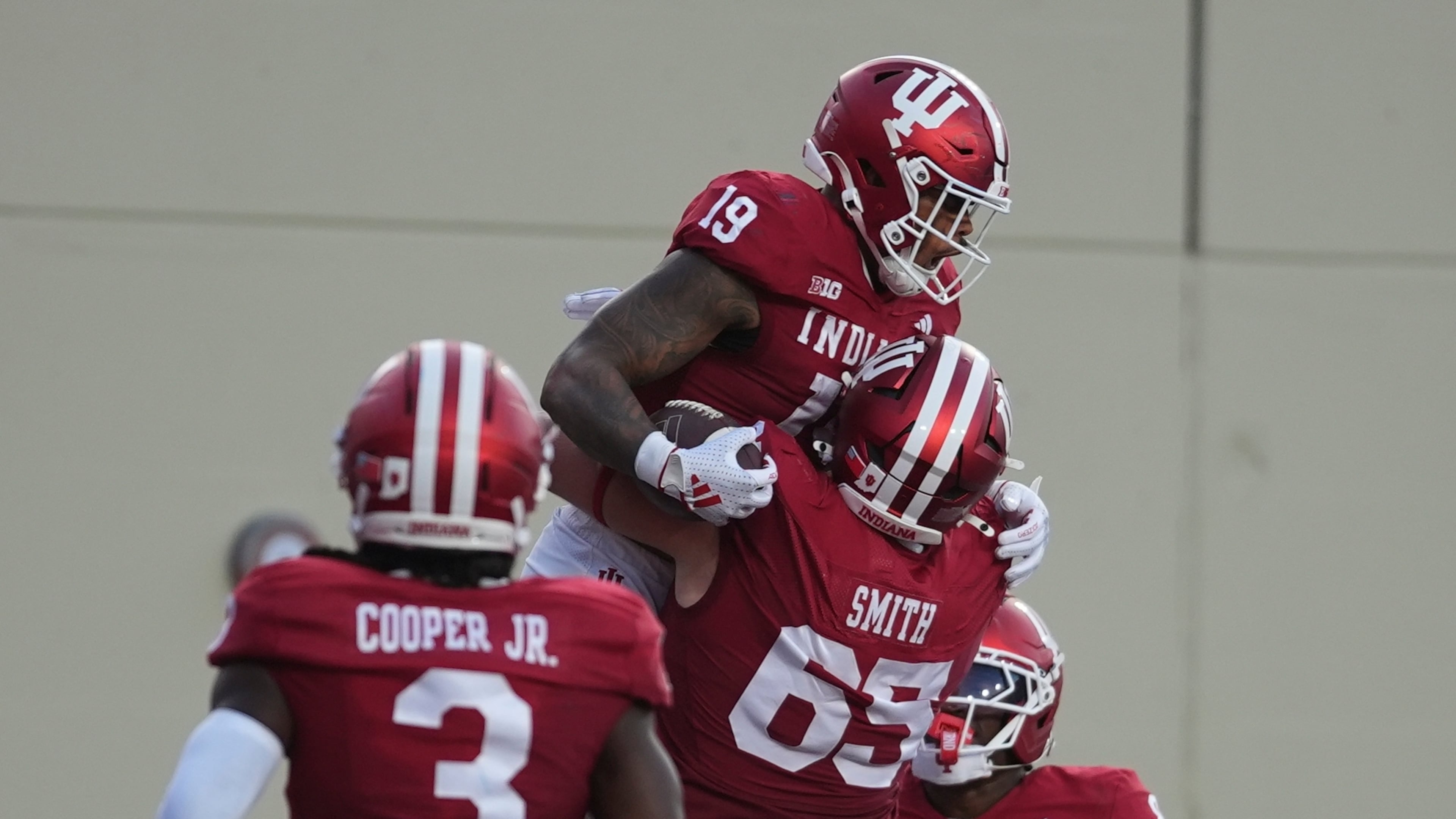 Indiana tight end Holden Staes (19) celebrates a touchdown catch with offensive lineman Carter Smith during the first half of an NCAA college football game against Indiana State , Friday, Sept. 12, 2025, in Bloomington, Ind. (AP Photo/Darron Cummings)