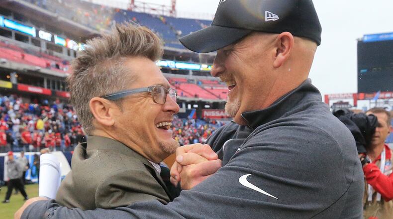102515 NASHVILLE: -- Falcons general manager Thomas Dimitroff (left) and head coach Dan Quinn celebrate surviving the Titans for a 10-7 victory in a football game on Sunday, Oct. 25, 2015, in Nashville. Curtis Compton / ccompton@ajc.com