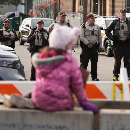 Law enforcement officers guard outside an ICE processing facility in the Chicago suburb of Broadview, Ill., Friday, Nov. 21, 2025. (AP Photo/Nam Y. Huh)