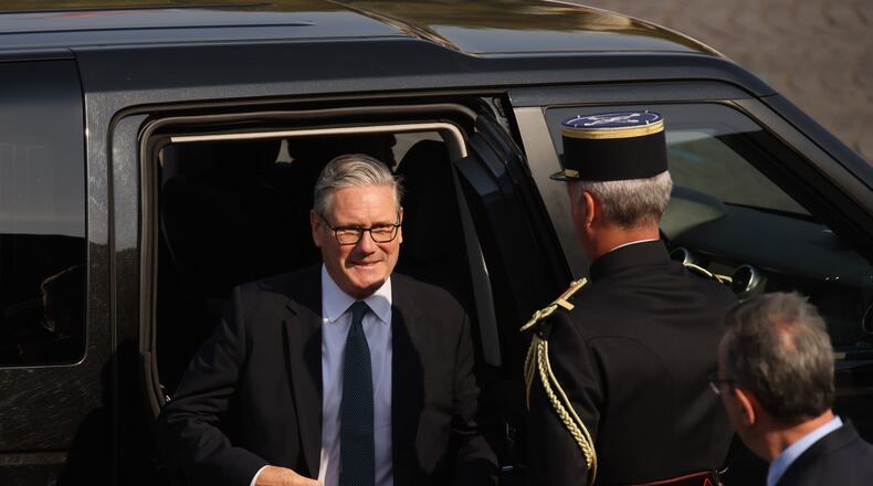 British Prime Minister Keir Starmer arrives for the Bastille Day military parade on the Champs-Elysees avenue in Paris, Tuesday, July 14, 2026. (AP Photo/Thomas Padilla)