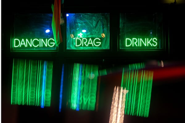 Signs light up the outside of Lore, a dancing and drag bar on Edgewood Avenue.