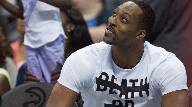 NBA center and Atlanta native Dwight Howard checks out the action. BRANDEN CAMP/SPECIAL