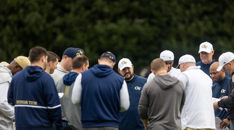 The coaching staff huddles during the first day of spring practice for Georgia Tech football at Alexander Rose Bowl Field in Atlanta, GA., on Thursday, February 24, 2022. (Photo Jenn Finch)
