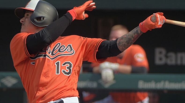 The Baltimore Orioles' Manny Machado hits a solo home run against Tampa Bay Rays starting pitcher Chris Archer in the third inning during the first game of a doubleheader at Oriole Park at Camden Yards in Baltimore on Saturday, May 12, 2018. The Orioles won, 6-3. (Karl Merton Ferron/Baltimore Sun/TNS)
